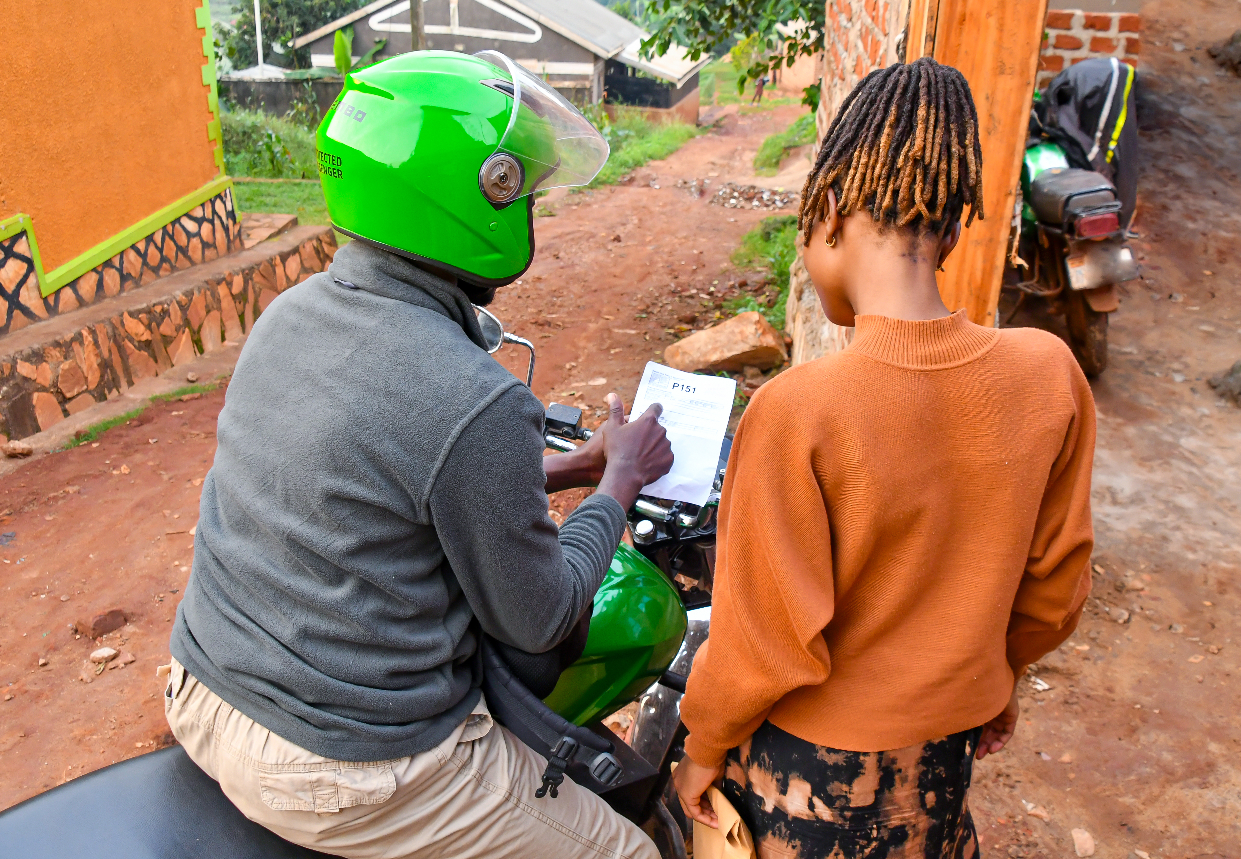 Community follow-up support beside a motorcycle